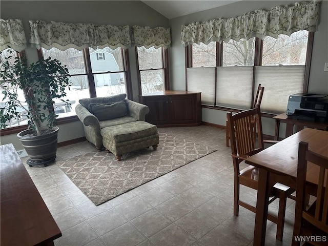 sunroom featuring vaulted ceiling