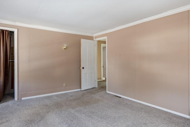 903 W 1st St, Elmira, NY 14905 - carpeted empty room with ornamental molding and baseboards