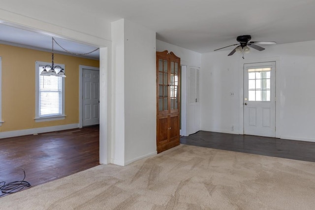 903 W 1st St, Elmira, NY 14905 - carpeted entrance foyer with a ceiling fan and a chandelier