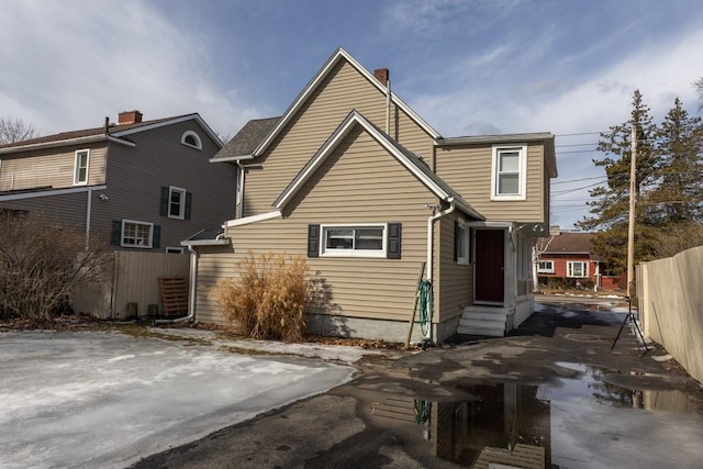 903 W 1st St, Elmira, NY 14905 - rear view of property featuring entry steps and a chimney