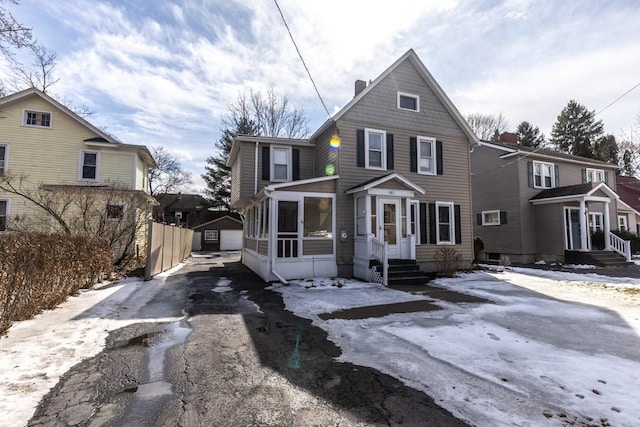 903 W 1st St, Elmira, NY 14905 - view of front facade with driveway and a garage