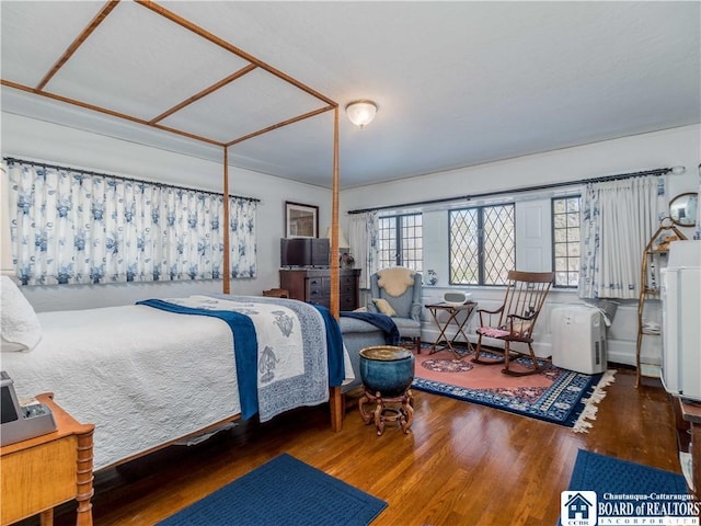 bedroom with wood finished floors