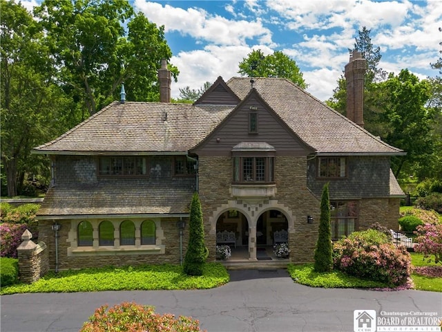 view of front of home featuring a chimney