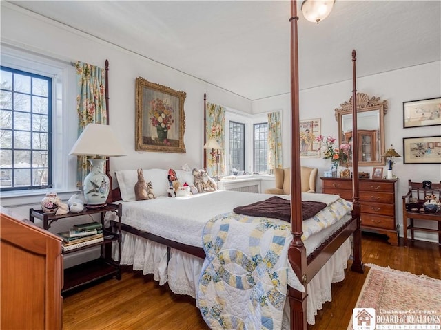 bedroom with wood finished floors