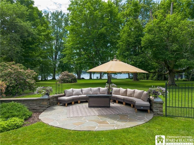 view of patio / terrace with outdoor lounge area and fence