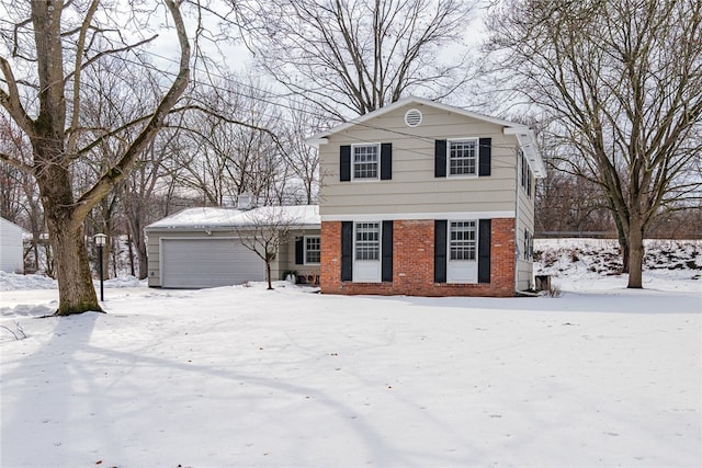 view of front of house with a garage and brick siding