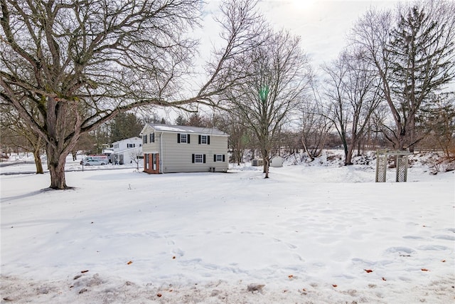 view of yard layered in snow