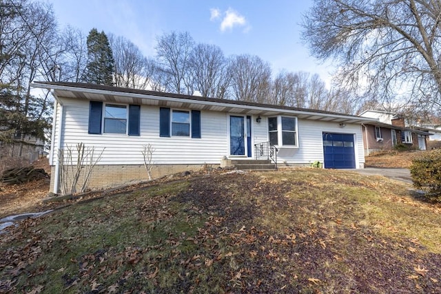 single story home with a garage and driveway