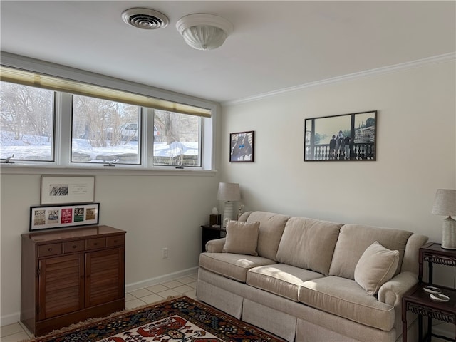 living area with baseboards, light tile patterned flooring, visible vents, and crown molding