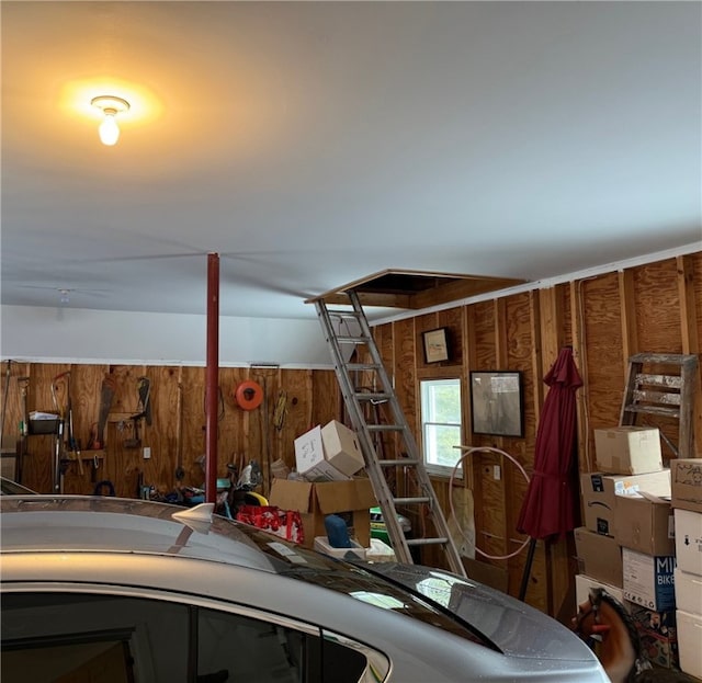 garage with wood walls