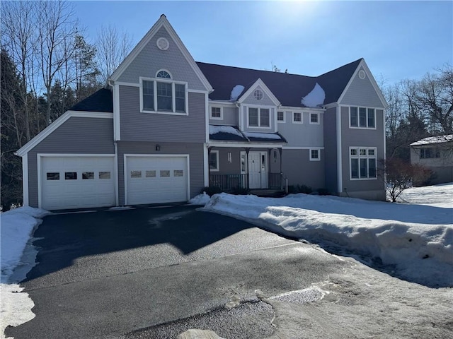 view of front facade featuring driveway and covered porch