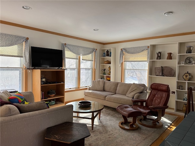 living area with recessed lighting, wood finished floors, and crown molding