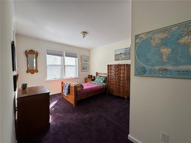 bedroom with dark colored carpet, crown molding, and baseboards