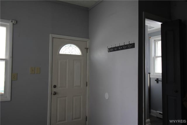 entrance foyer with plenty of natural light and a baseboard radiator