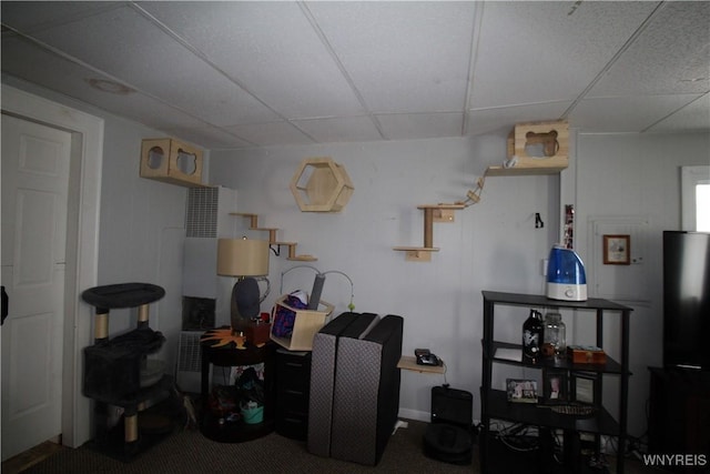 interior space featuring a paneled ceiling