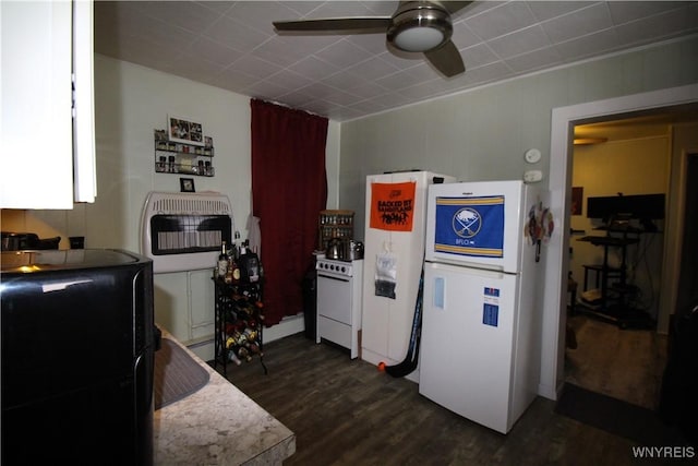 kitchen featuring heating unit, white appliances, dark wood finished floors, and a ceiling fan