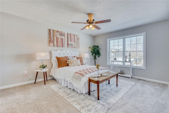 bedroom with carpet floors, baseboards, and a ceiling fan