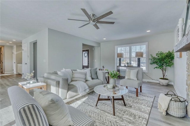 living room with a ceiling fan, baseboards, wood finished floors, and recessed lighting