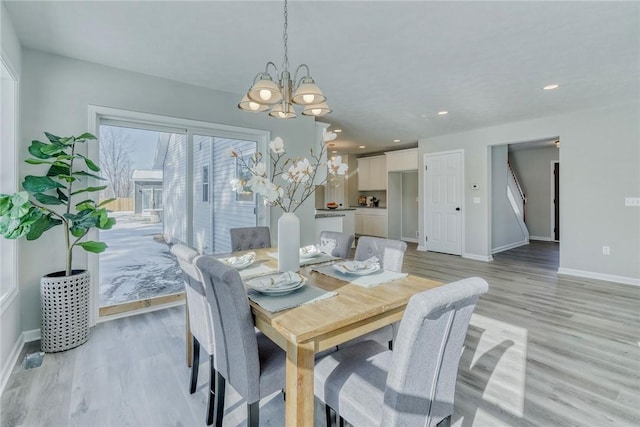 dining area featuring a chandelier, recessed lighting, baseboards, and light wood-style floors