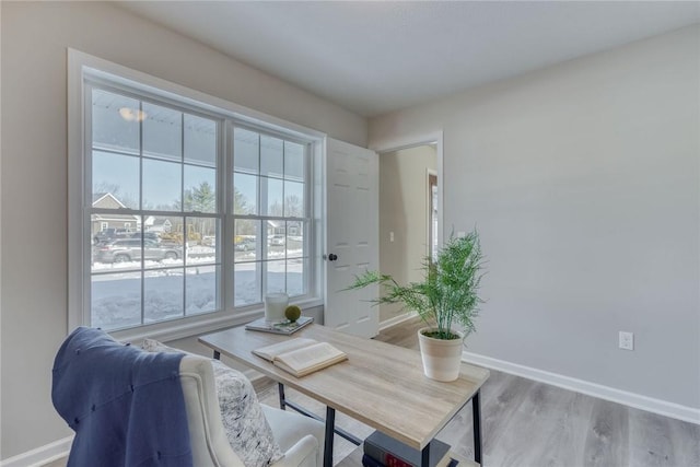 home office with wood finished floors and baseboards