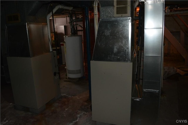 utility room featuring water heater and heating unit