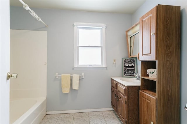 full bathroom featuring tile patterned floors, baseboards, and vanity