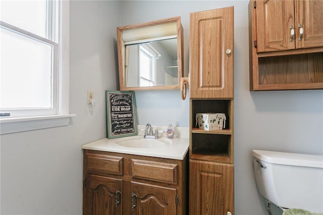 bathroom with vanity and toilet