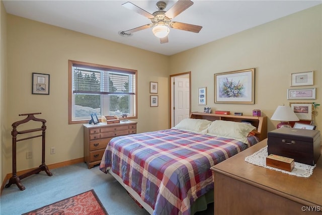 bedroom featuring light carpet, ceiling fan, and baseboards