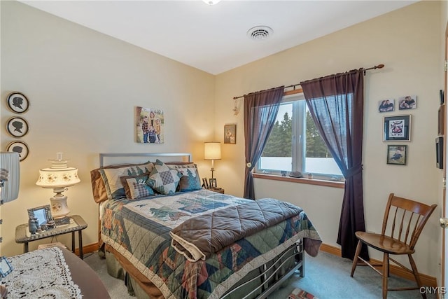 carpeted bedroom with baseboards and visible vents