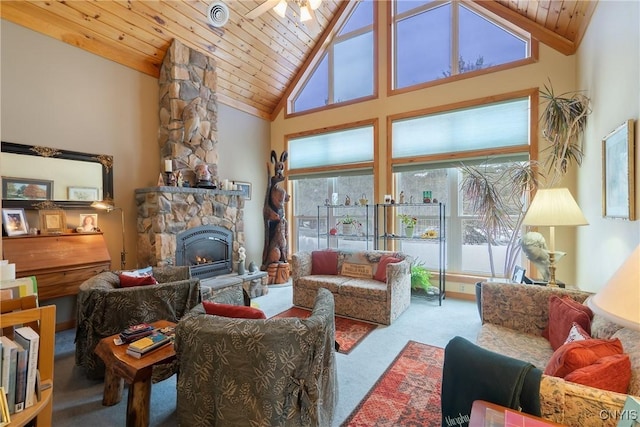living area featuring high vaulted ceiling, a stone fireplace, wood ceiling, and carpet floors