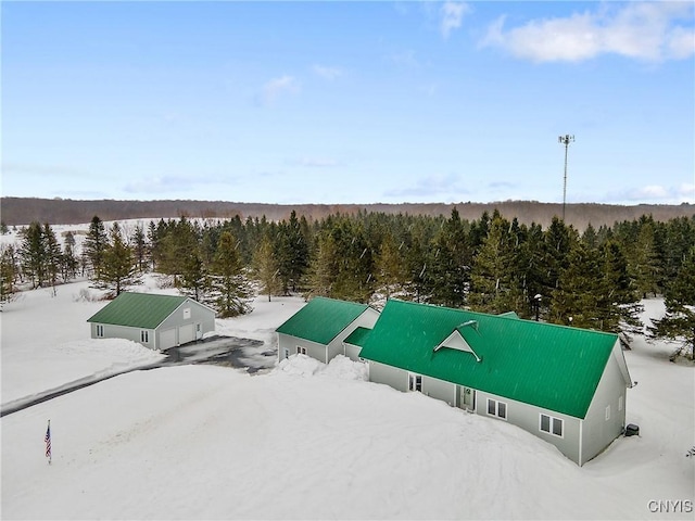 birds eye view of property with a forest view