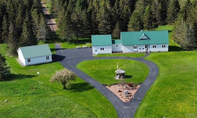 aerial view featuring a wooded view