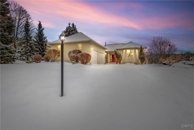 ranch-style house featuring a garage