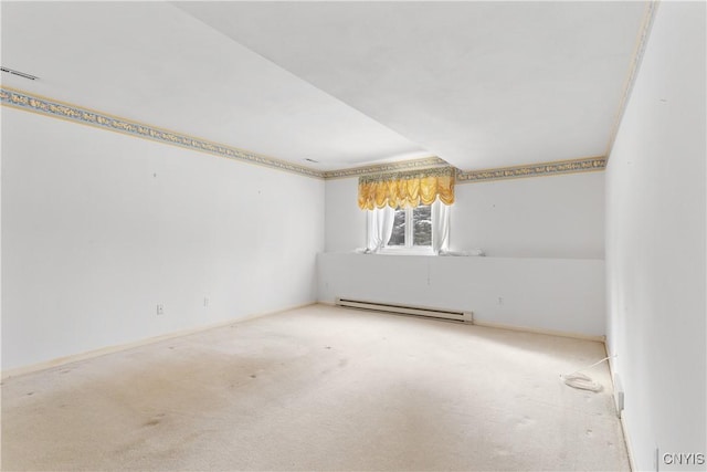 carpeted empty room with baseboard heating and visible vents