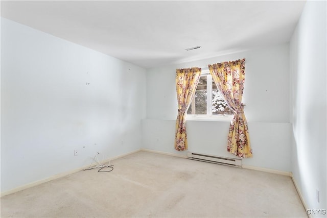 carpeted empty room with a baseboard radiator, visible vents, and baseboards