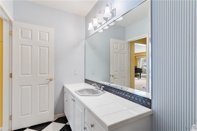 bathroom featuring wallpapered walls, vanity, and tile patterned floors