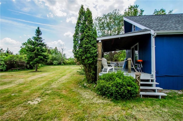 view of yard featuring covered porch