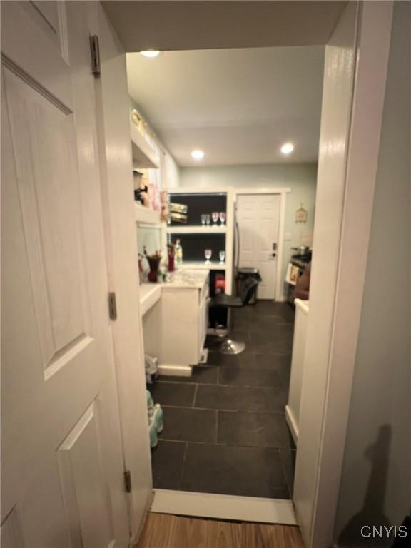 interior space with dark wood-type flooring and recessed lighting