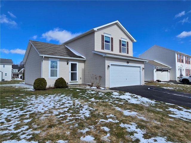 traditional home featuring driveway and a garage