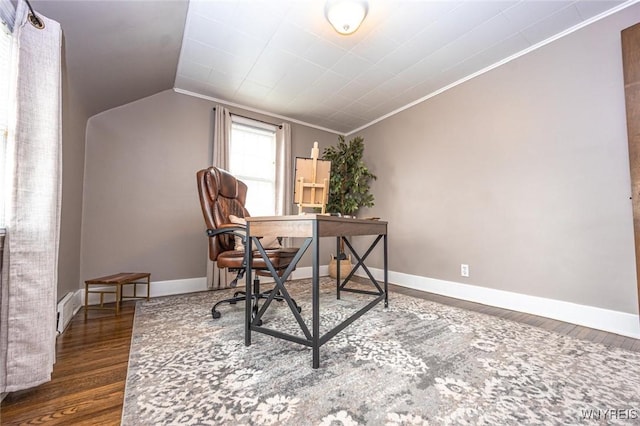 office with baseboards, ornamental molding, vaulted ceiling, and wood finished floors