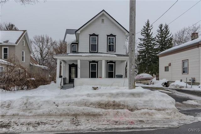 view of front of property with covered porch and metal roof