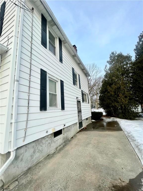 view of side of property featuring a chimney