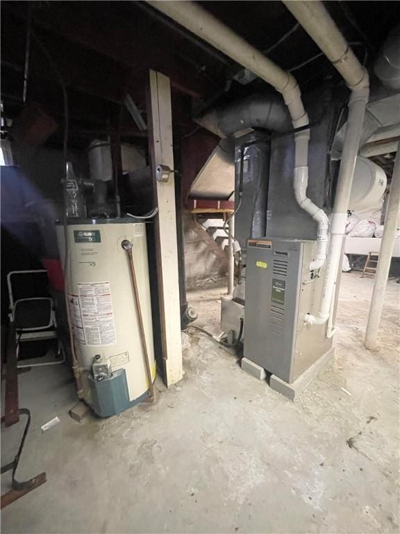 utility room with water heater and heating unit