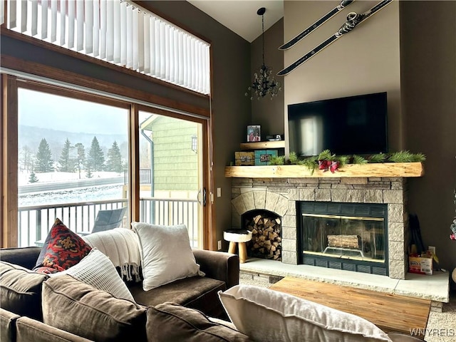 living room with high vaulted ceiling and a stone fireplace