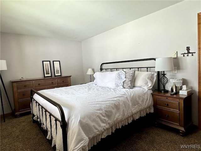 bedroom featuring dark carpet