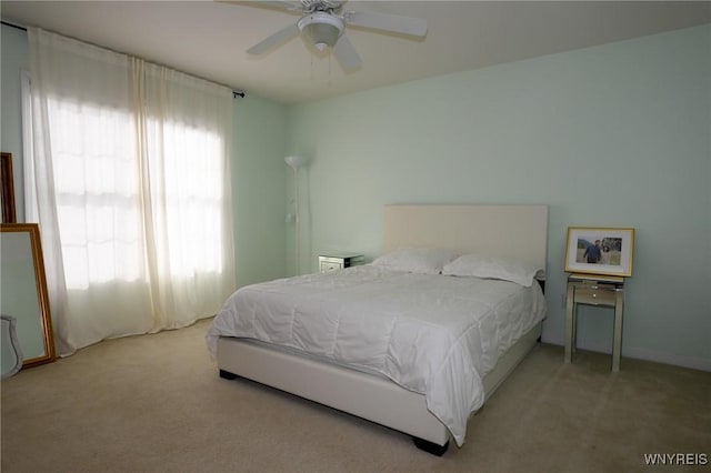 carpeted bedroom featuring a ceiling fan