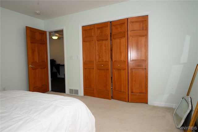 carpeted bedroom with visible vents