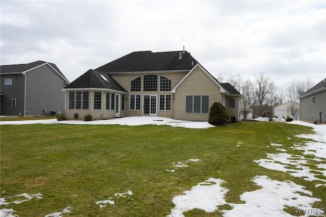 rear view of house with a patio and a yard