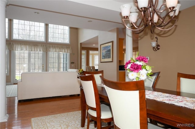 dining room featuring a notable chandelier and wood finished floors