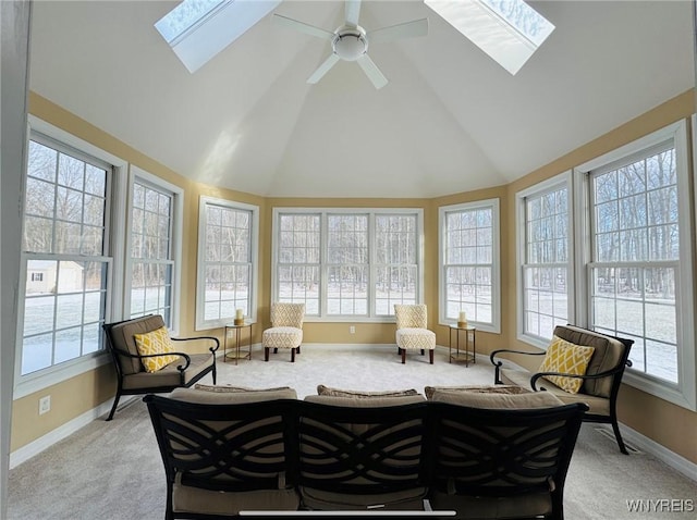 sunroom featuring vaulted ceiling with skylight and ceiling fan